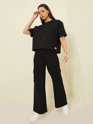 A women wearing a black half sleeve t shirt pyjama co ord set