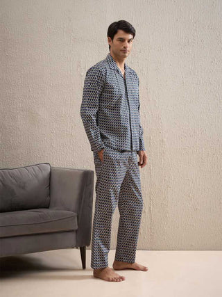a men standing and weared a dark grey full sleeve front open pyjama set
