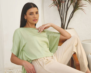 A women sitting on chair wearing a co ord set