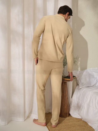 Men wearing a beige textured pajama set, standing from the back.