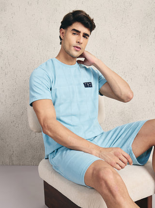 Men's light blue checkered short-sleeve t-shirt and shorts set.