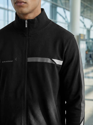 Men's black zip-up track jacket with a reflective stripe detail on the chest and sleeves, suitable for loungewear.