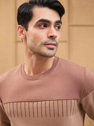 Men's taupe crewneck sweatshirt with a contrasting horizontal stripe print and embroidered logo.