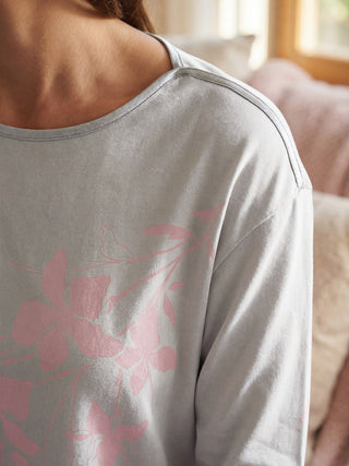 Women's grey long-sleeved pajama top with pink floral print.