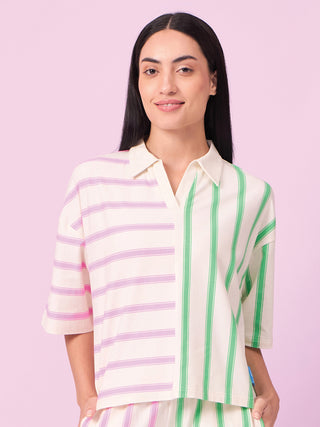 Women's cream pajama set with green and pink stripes.