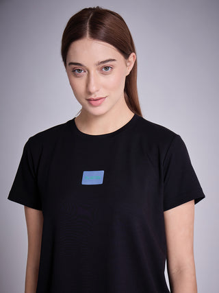 Women wearing a black t-shirt with a light blue square print.