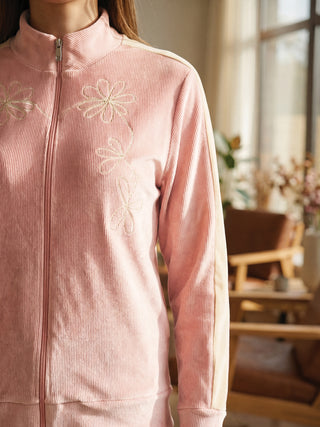 Women's pink corduroy zip-up loungewear jacket with floral embroidery.