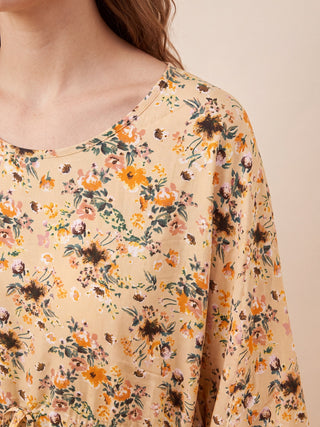Women's light yellow floral print short-sleeve pajamas with a round neckline.