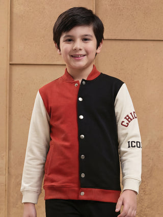 BOYS: A young boy in a colorblock bomber jacket.