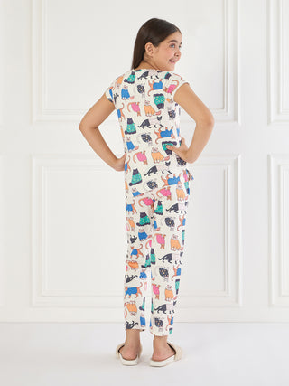 Girls' ivory pajama set with a colorful all-over cat print.