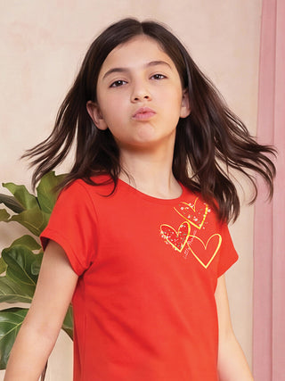 GIRLS red t-shirt with heart print.