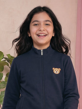 GIRLS navy blue zip-up jacket with a teddy bear print, also featuring a mock neck.