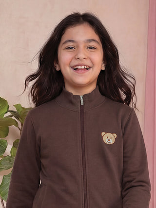 GIRLS in a brown zip-up sweatshirt with a teddy bear print.