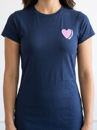 Women's navy blue t-shirt with a pink heart print that says "hello newborn".