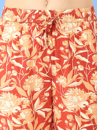 Women's rust red floral print pajama shorts with a drawstring waist.