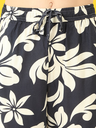 Women's dark blue floral print pajama pants with a drawstring waist.