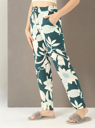 Women's dark green floral print lounge pants with a drawstring waist and side pockets.