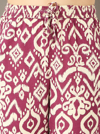 Women's magenta and cream ikat print pajama bottoms with a drawstring waist.