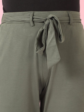 Women's olive green tie-waist pajama pants.