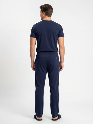 Men's dark blue pajama set, back view.