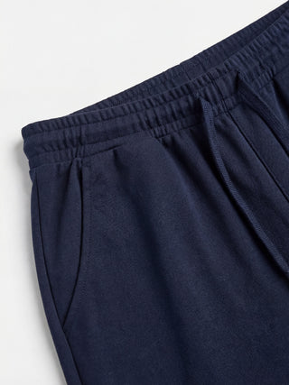 Men's navy blue sweatpants with a drawstring waist and pockets.