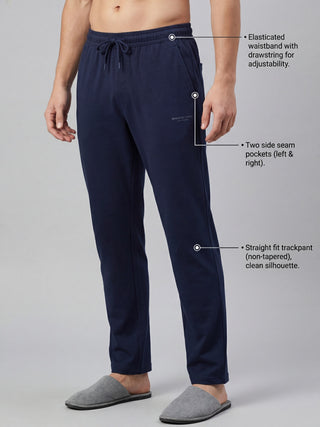 Men's navy blue cotton trackpants with an elasticated waistband, drawstring, two side seam pockets, and a straight fit.