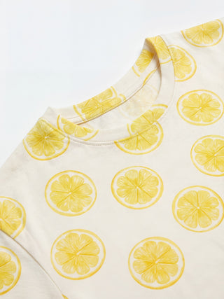 Women's light yellow crew neck t-shirt with a pattern of lemon slices.