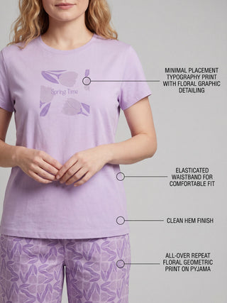Women's light purple short-sleeve t-shirt with a "Spring Time" tulip graphic and matching floral patterned pants.