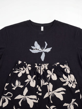 Women's black pajamas with a floral print.