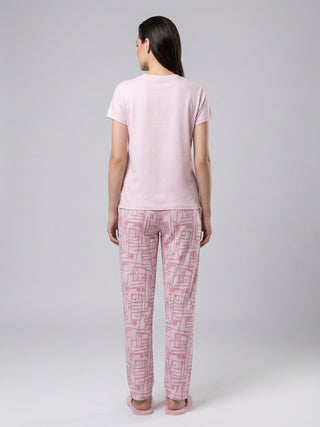 Women's pink printed pajamas, seen from behind.