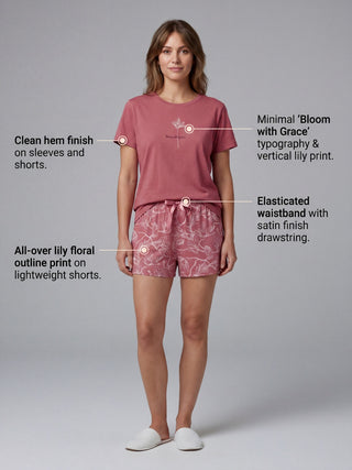 Women's pink lily print pyjama set with a clean hem finish on the sleeves and shorts, and an elasticated waistband with satin finish drawstring.