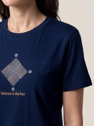 Women's navy blue t-shirt with a geometric print and text.