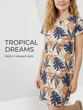 Women wearing a cream-colored t-shirt dress with a tropical leaf print.