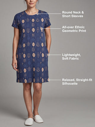 Women in a relaxed, straight-fit, blue, all-over ethnic geometric print sleep dress with a round neck and short sleeves.
