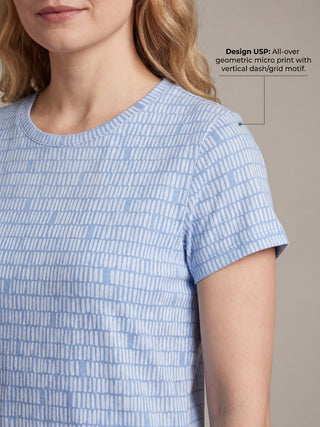 Women wearing a light blue t-shirt with a white geometric micro print.