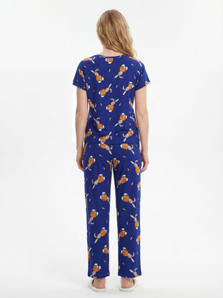 Women wearing blue pajamas with a bunny and carrot print.