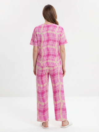 Women's pink plaid pajama set, viewed from the back.