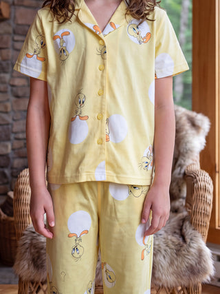 GIRLS wearing yellow Tweety Bird print pajama set.