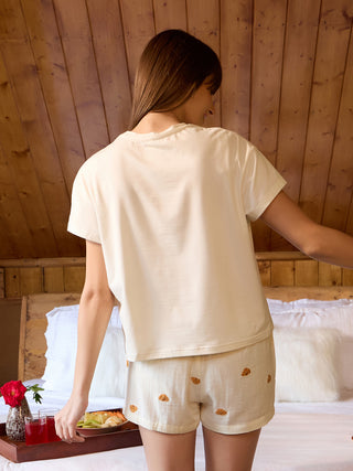Women's cream cotton short pajamas with a teddy bear print.