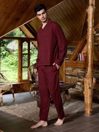 Men's burgundy patterned pajamas, standing.