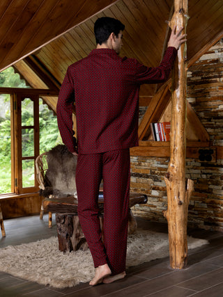 Men's burgundy patterned pajamas, standing, with a different pose.