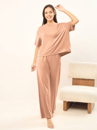 women standing wearing simply lazy brush pyjama set made of modal spandex