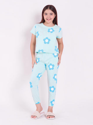 Sweet Dreams CottonEase Daisy Dream pyjama set in light blue with floral print worn by a young girl