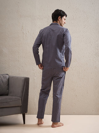 a men standing wearing black gentlemen printed pant set made of cotton modal aop