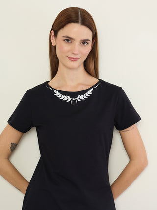 Women's black short-sleeve t-shirt sleepwear with a laurel wreath print around the neckline and dots.