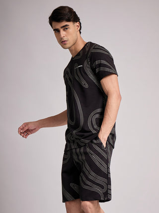 Men wearing a black t-shirt and shorts with a wavy silver print.