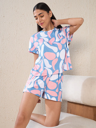 a woman wearing a blue nightwear short set
