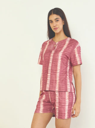 Women wearing a maroon tie-dye print pajama set.