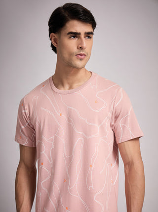 Men wearing a pale pink t-shirt with a white abstract topographic print.