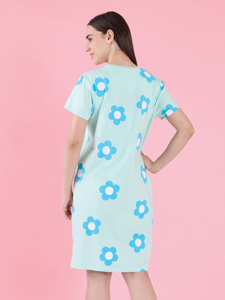 Women's mint green sleep dress with a blue floral print, shown from the back with the model standing.